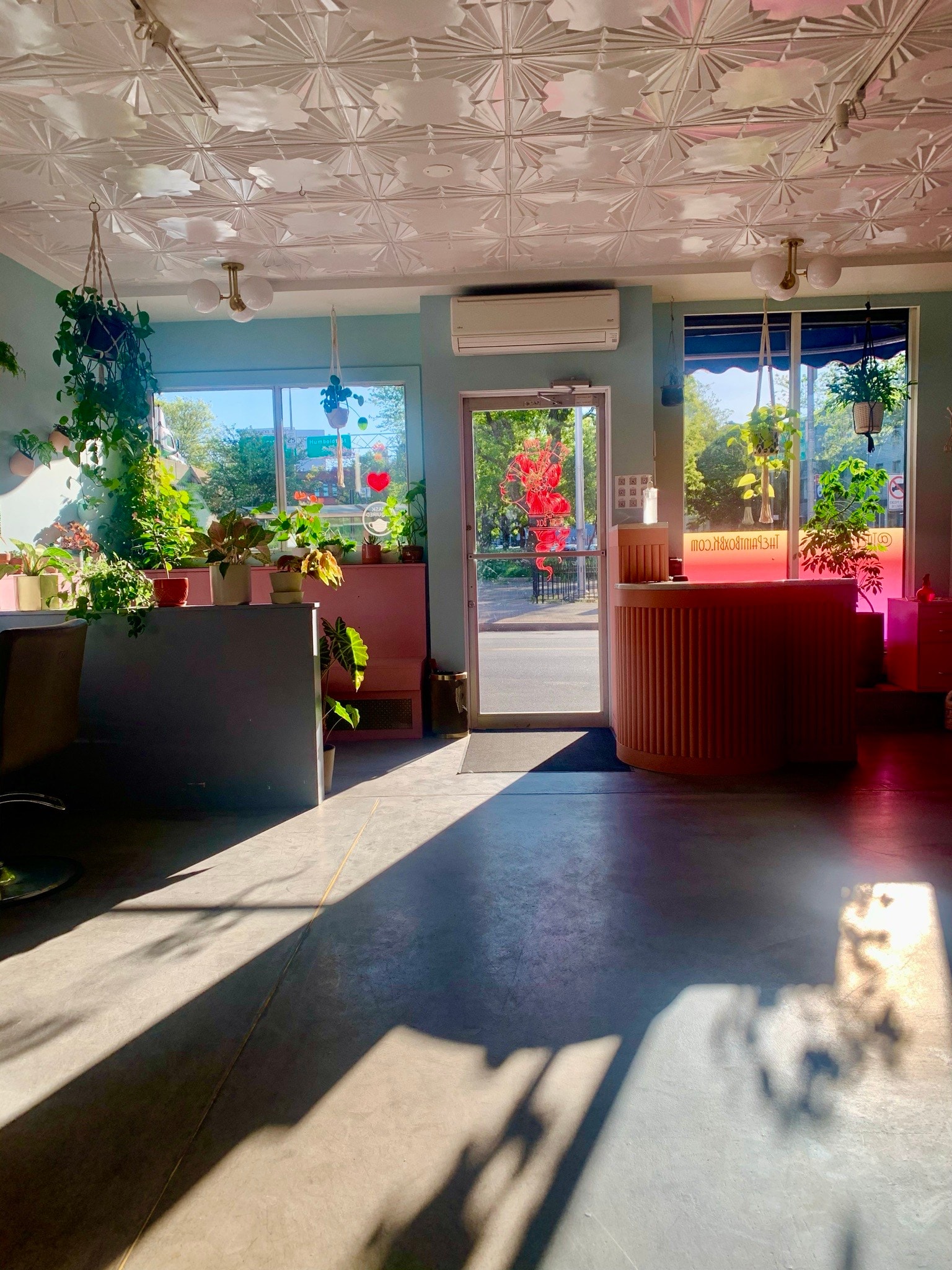 The Paint Box salon reception with turquoise walls